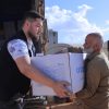 تقديم مساعدات إغاثية للمتضررين من العاصفة في مخيم كويرس في أرمناز